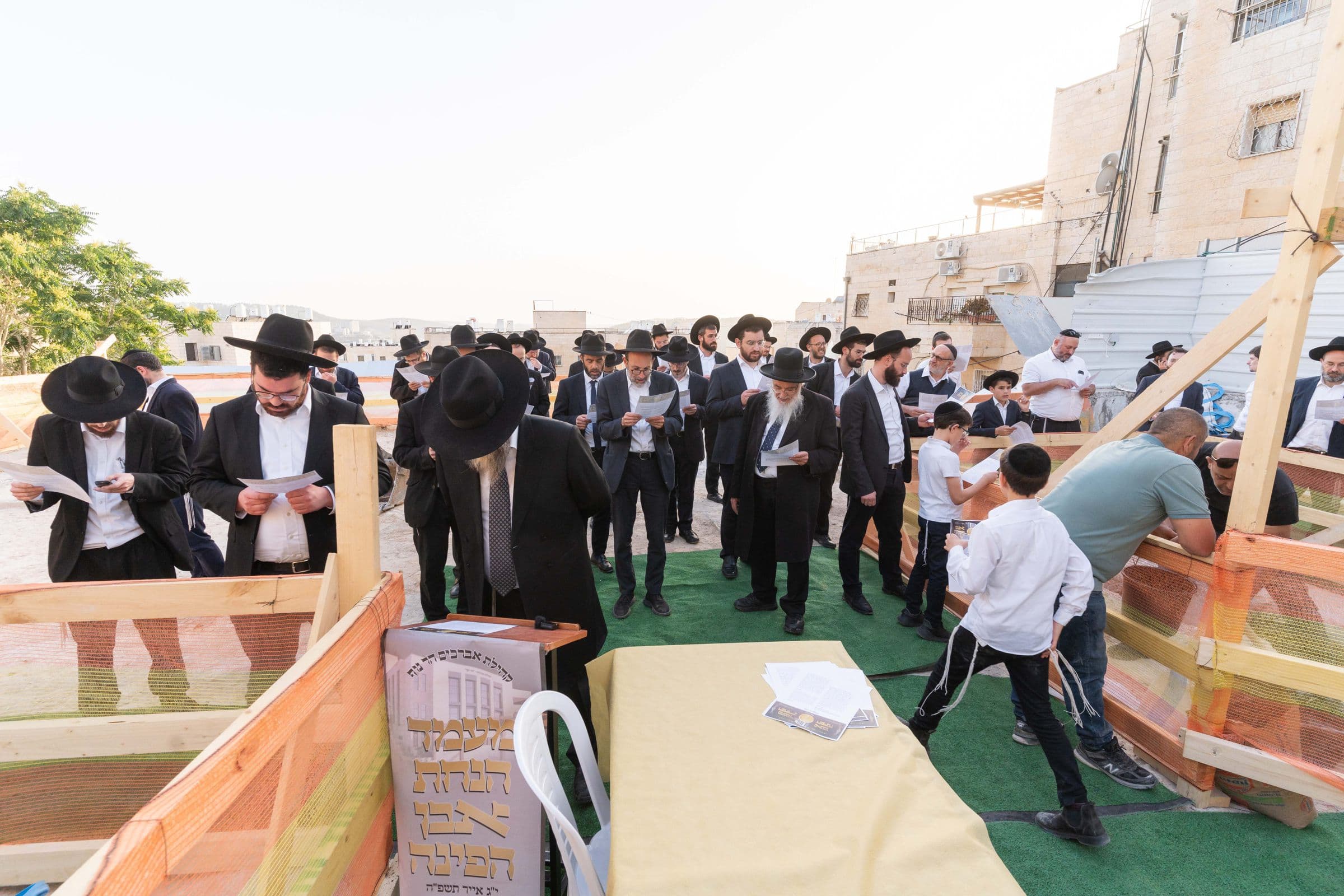 The kehila gathered at the building site