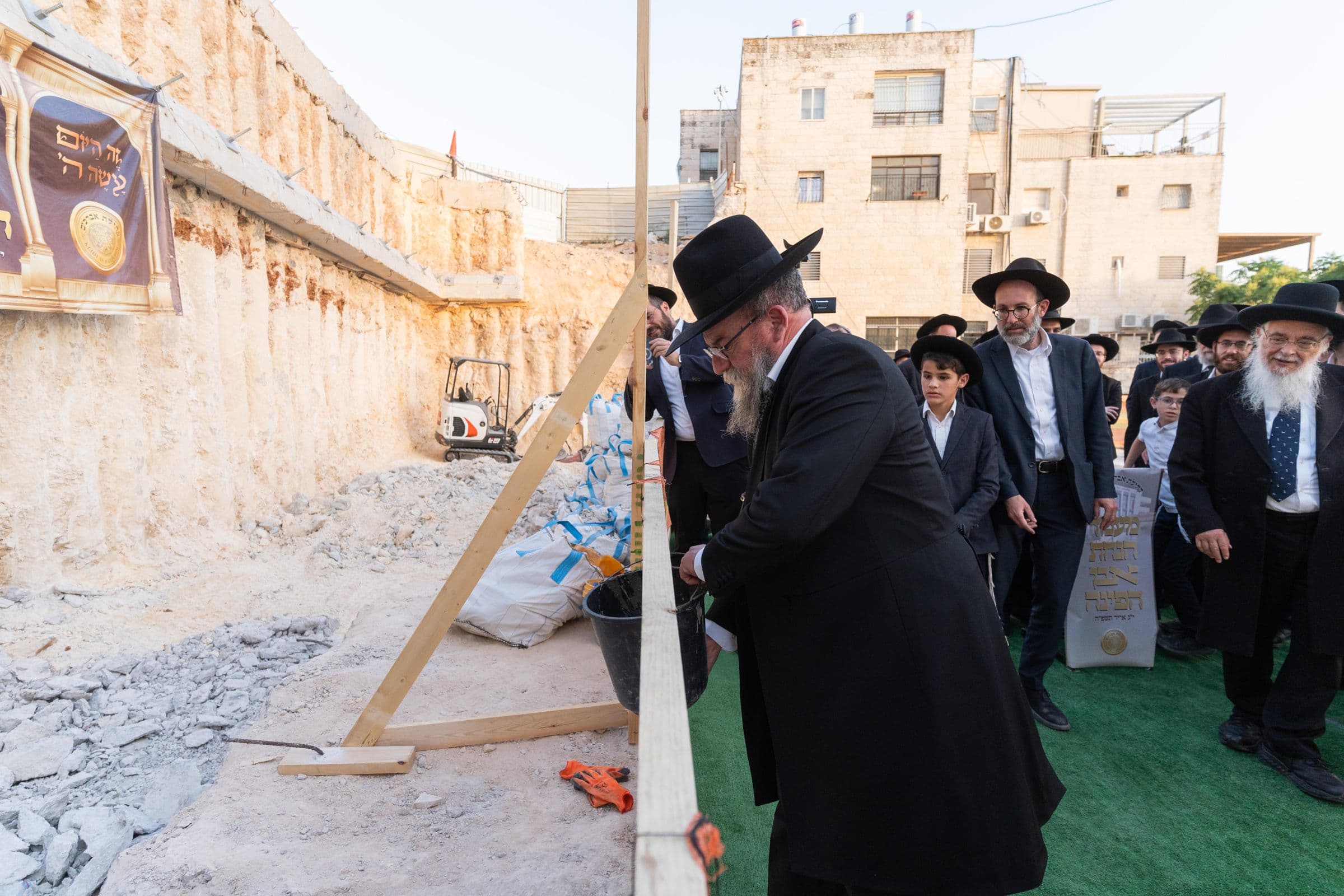 Pouring the foundations of the new shul